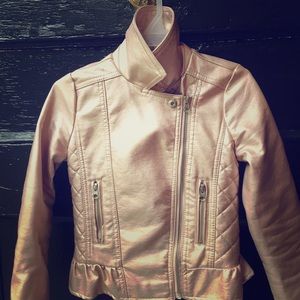 Faux leather little girls’ pink jacket.